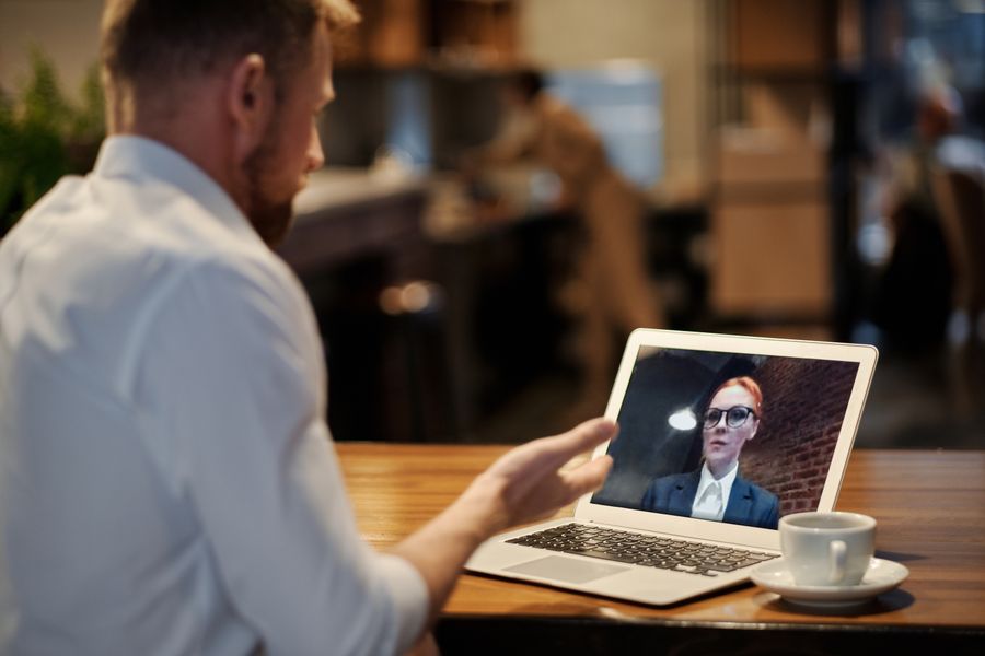man in white dress shirt using a laptop — Developers · Barbados: From departure lounge to arrival hall, the data never drops.