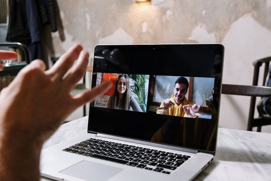 man and woman video call on laptop — Developers · Cuba: From departure lounge to arrival hall, the data never drops.