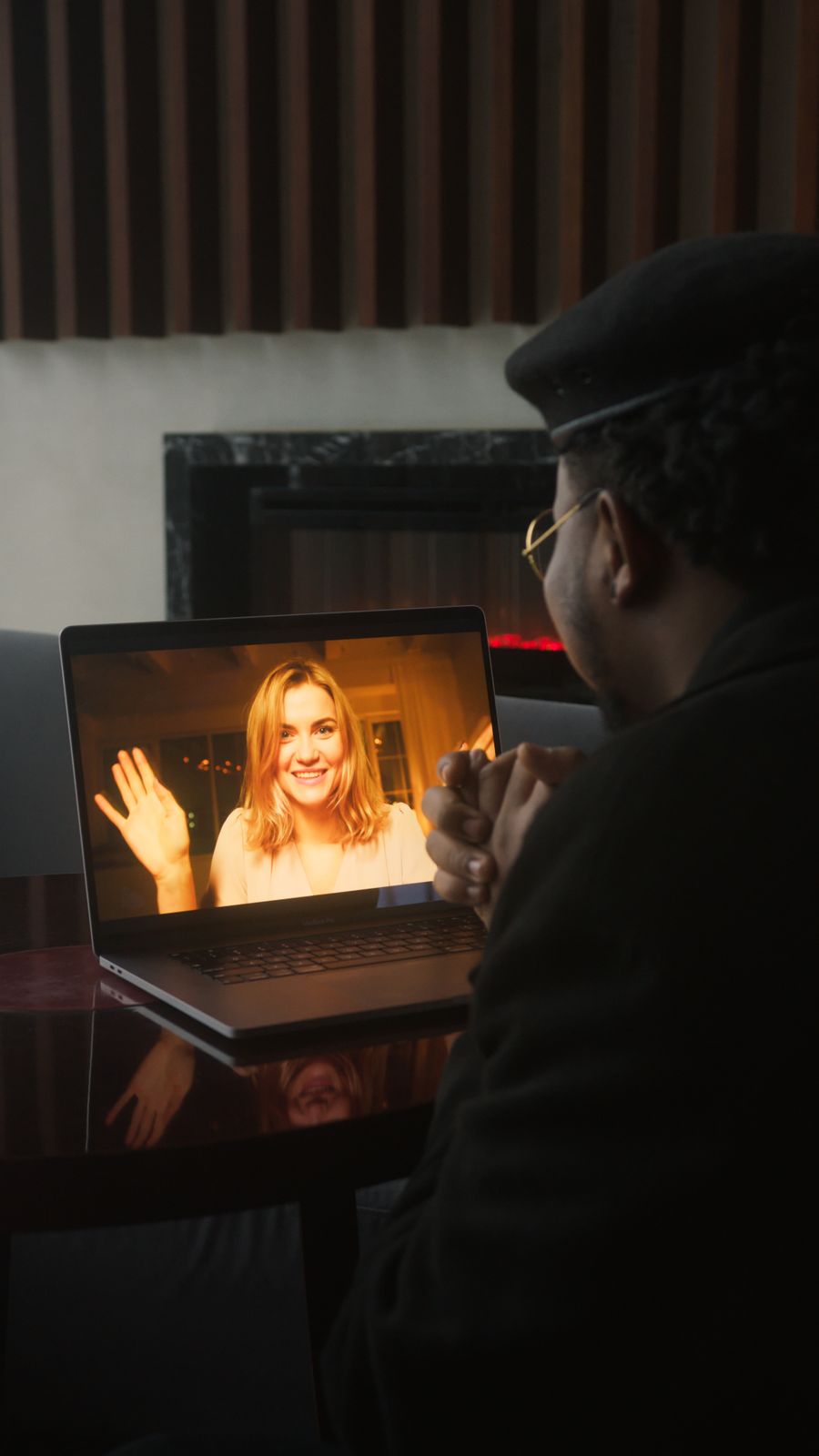 man looking at a woman in a laptop screen — Docs: The rental desk handshake: confirmation email open, license photo ready.
