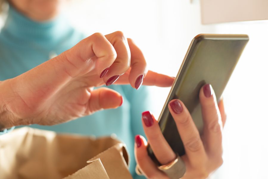 close up photo of person using smartphone — Developers · Andorra: Webhooks tell you when data runs low, plans expire, top-ups land.