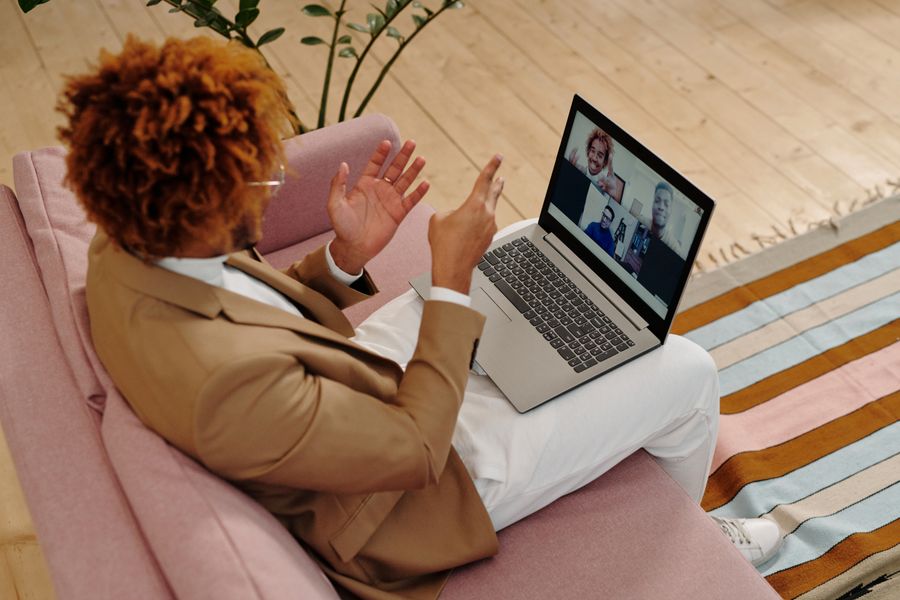 man sitting on sofa talking on webcam on laptop — Developers · Argentina: SDKs, a CLI, and an MCP server — the developer surface, complete.
