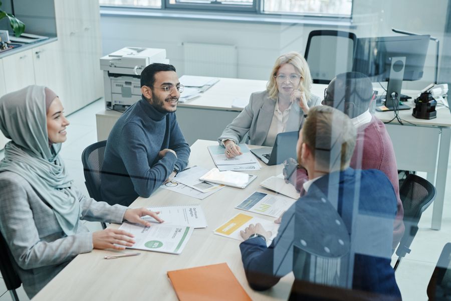 employees having a meeting inside the conference room