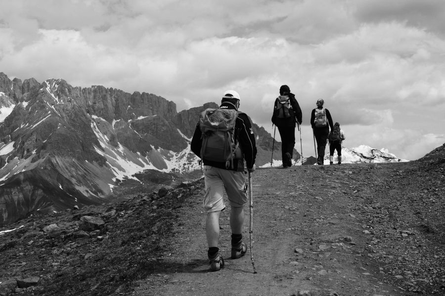 grayscale photo of people hiking on the mountain — Developers · Monaco: Museum afternoons with audio guides streaming, not buffering.