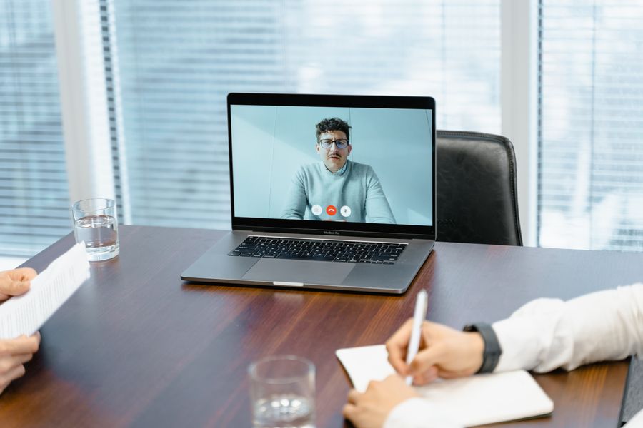 a businessman in an online meeting — Terms: Rain or shine, the connection holds — weather doesn't throttle data.