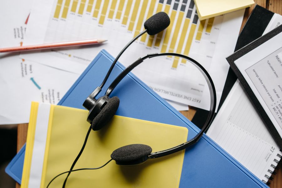 a close up shot of a headset on documents — Developers · Monaco: Travelers stay online from the moment they land — no SIM queues, no roaming shock.