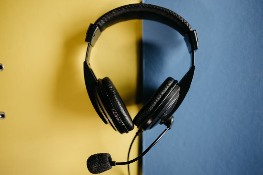black corded headphones on blue and yellow surface — Developers · Burkina Faso: Currency exchange, skipped: the phone pays at the real rate.