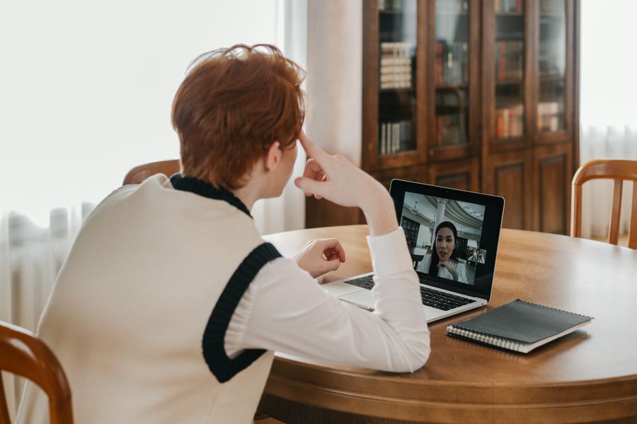 a man having a video call on his laptop — Developers · Bangladesh: The status page is public — uptime you can verify, not claim.