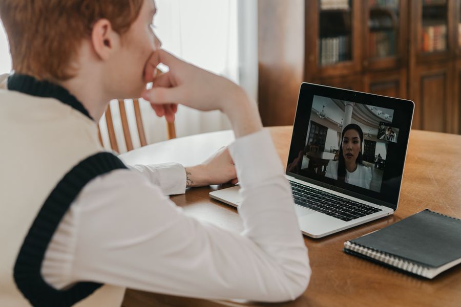 a man having a video call on his laptop — Developers · Luxembourg: The welcome home: eSIM deleted in one tap, no contract to cancel.