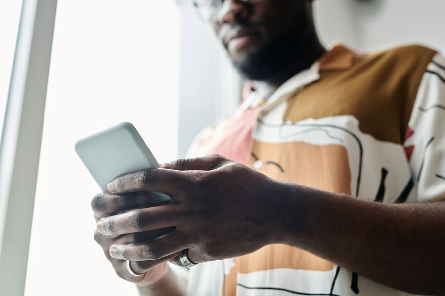 close up shot of a man using a smartphone — Developers · Lebanon: Street level: navigation, rideshares and reviews, all instant.