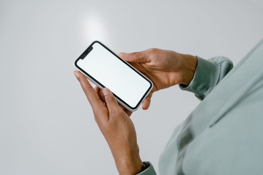 photo of a person holding a smartphone — Developers · Belgium: The welcome home: eSIM deleted in one tap, no contract to cancel.