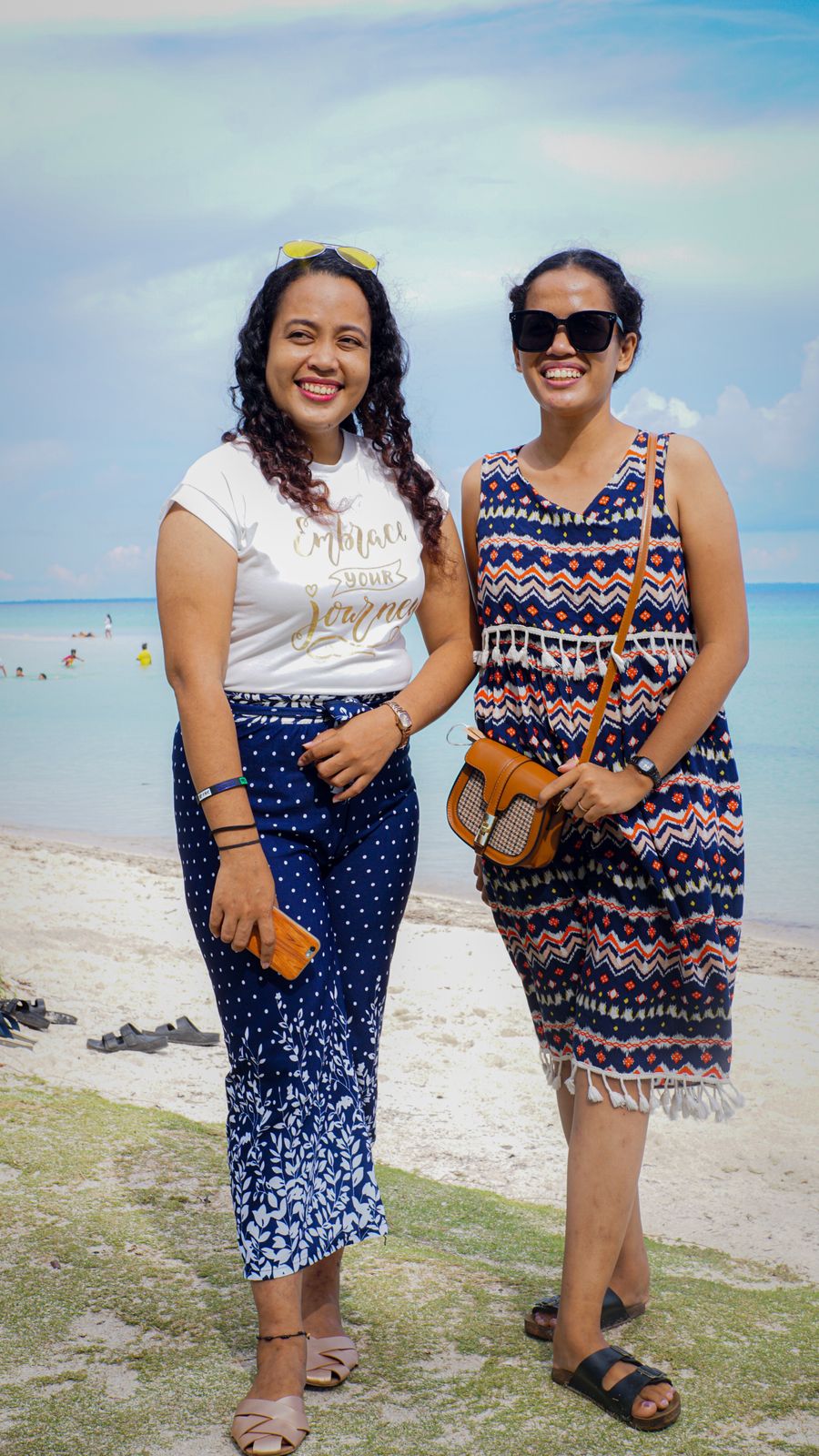 portrait of two women on a beach — Developers · Malta: Golden hour, fully online — photo backups upload before dinner.