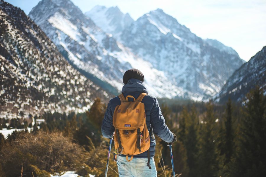 men s blue leather jacket and brown backpack — Developers · Italy: The long layover: streaming, working and messaging, all covered.