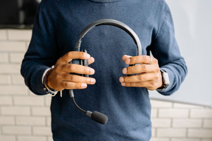 a person holding a headset — Developers · Thailand: The night bus: entertainment downloaded, messages queued, rest easy.