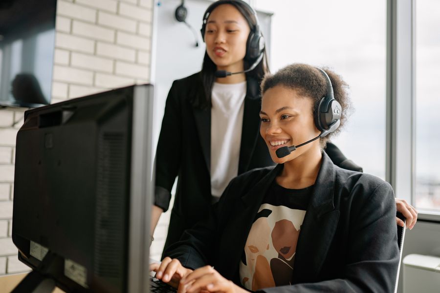 two women with headsets working as call center agents — Developers · the Dominican Republic: Street level: navigation, rideshares and reviews, all instant.