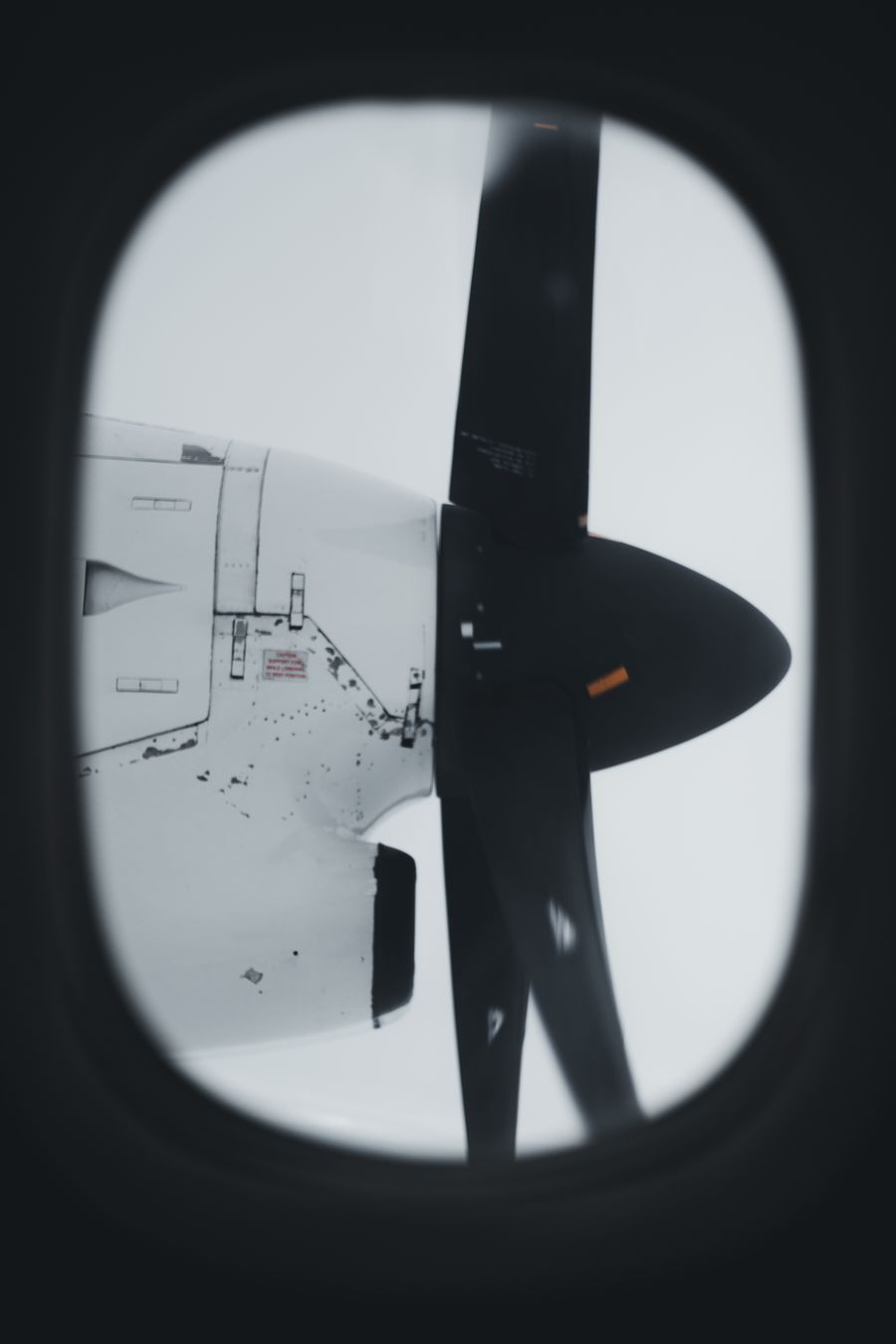 aircraft propellers through a plane window — Developers · Barbados: Coworking abroad: laptop tethered, calls crisp, deadlines met.