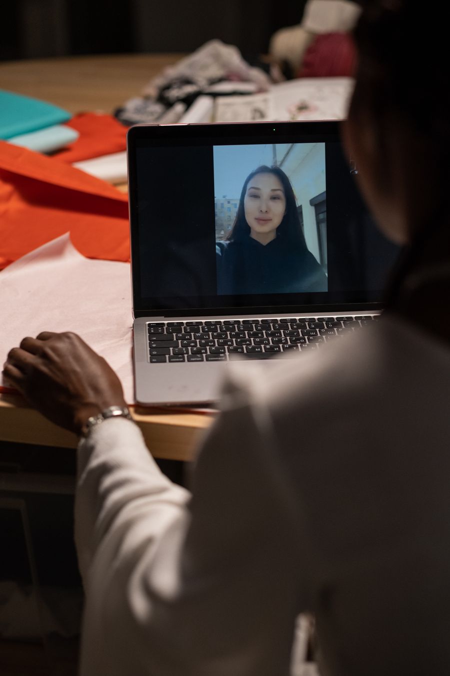 creative professional on video call — Developers · Ecuador: The last night: photo album backed up, memories safe before wheels-up.